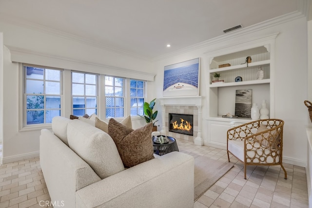 2569 Bungalow Pl, Corona Del Mar, CA 92625 - living room featuring crown molding, built in features, a tiled fireplace, and recessed lighting