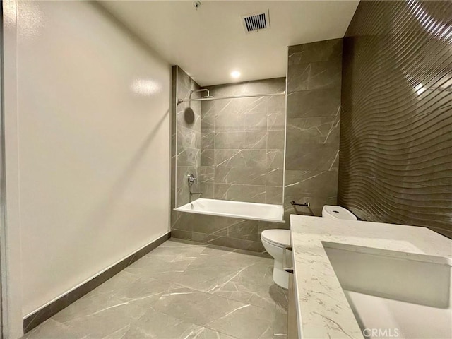 400 S Broadway Unit 1202, Los Angeles, CA 90013 - full bath featuring tiled shower / bath combo, marble finish flooring, vanity, and recessed lighting