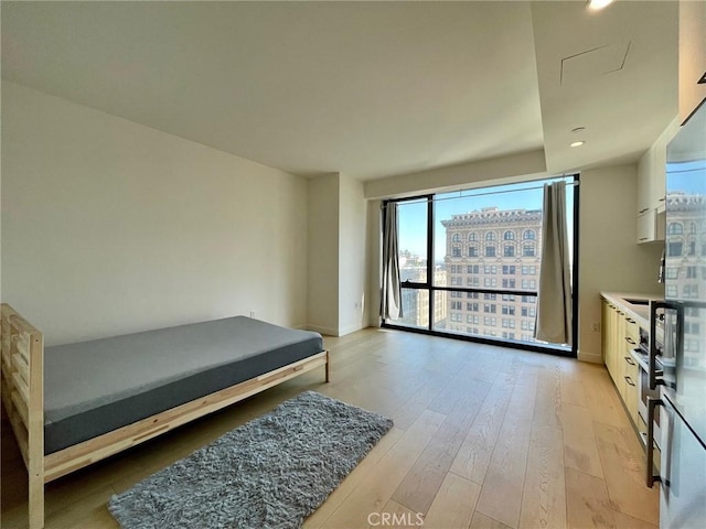 400 S Broadway Unit 1202, Los Angeles, CA 90013 - bedroom with light wood-style floors and recessed lighting