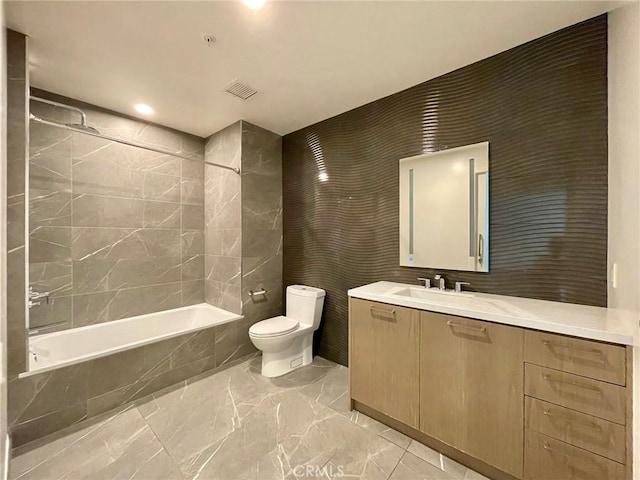400 S Broadway Unit 1202, Los Angeles, CA 90013 - bathroom featuring marble tiled flooring, tiled shower / bath combo, vanity, and recessed lighting