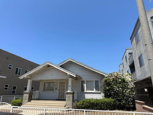 1045 Gladys Ave, Long Beach, CA 90804 - view of front of home featuring a porch and a fenced front yard