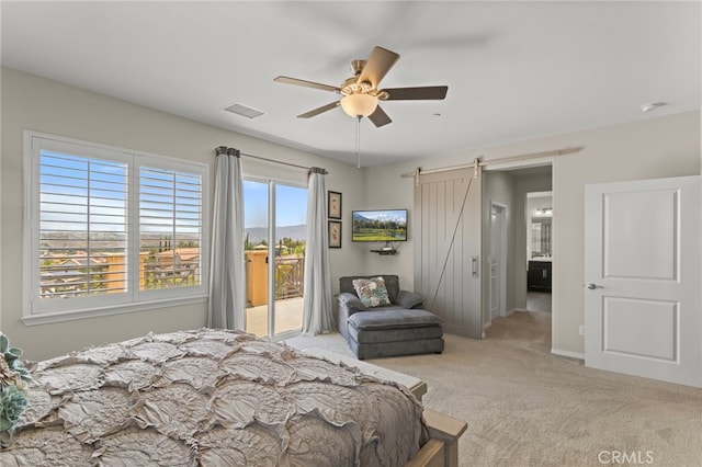 44316 Revana St, Temecula, CA 92592 - carpeted bedroom featuring access to outside, a barn door, and a ceiling fan