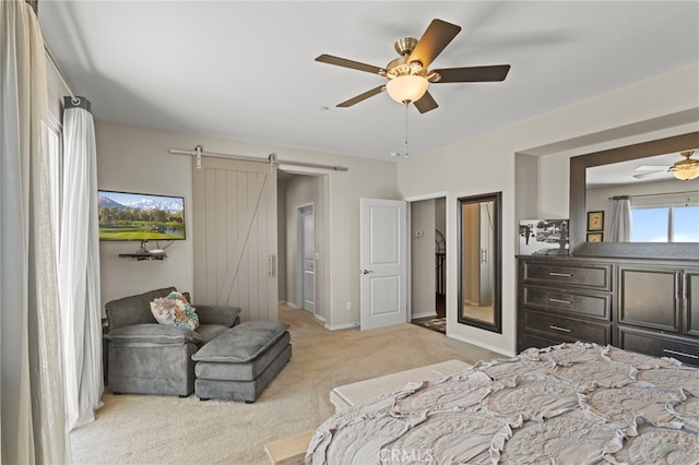 44316 Revana St, Temecula, CA 92592 - bedroom featuring a barn door, light carpet, and ceiling fan