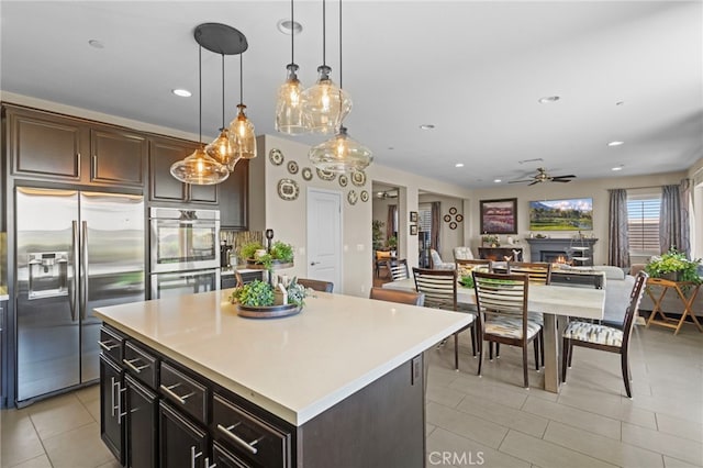 44316 Revana St, Temecula, CA 92592 - kitchen featuring appliances with stainless steel finishes, a ceiling fan, light tile patterned floors, light countertops, and recessed lighting