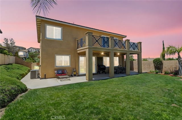 44316 Revana St, Temecula, CA 92592 - back of house with a balcony, a fenced backyard, a patio area, and stucco siding