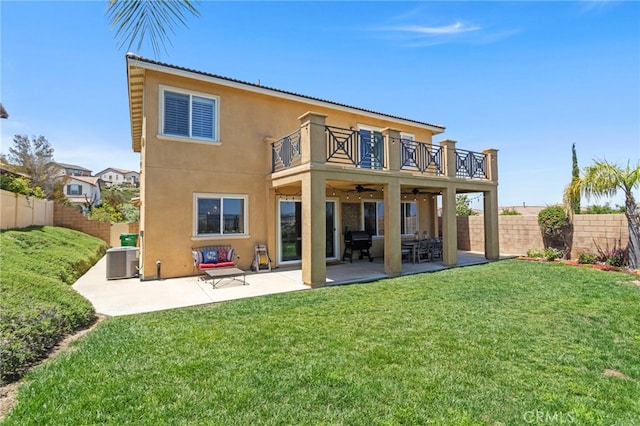 44316 Revana St, Temecula, CA 92592 - rear view of property featuring a balcony, a ceiling fan, a fenced backyard, and stucco siding