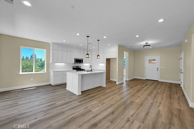 5350 Filbert St, Paradise, CA 95969 - kitchen with stainless steel appliances, open floor plan, white cabinets, light countertops, and recessed lighting