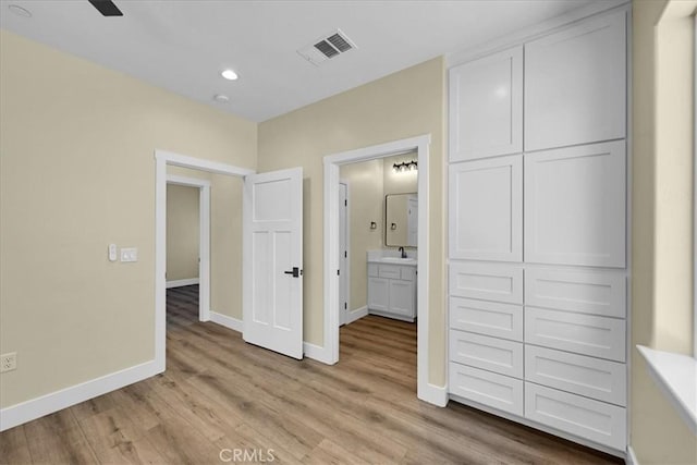 5350 Filbert St, Paradise, CA 95969 - unfurnished bedroom featuring light wood-style floors, recessed lighting, a closet, and ensuite bath