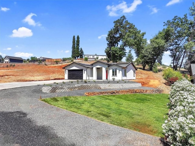 5350 Filbert St, Paradise, CA 95969 - view of front of house with driveway, an attached garage, and a front lawn