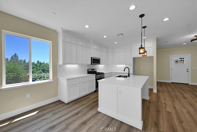 5350 Filbert St, Paradise, CA 95969 - kitchen featuring stainless steel appliances, plenty of natural light, white cabinets, light countertops, and recessed lighting