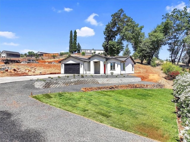 5350 Filbert St, Paradise, CA 95969 - view of front of house featuring driveway, a garage, and a front lawn
