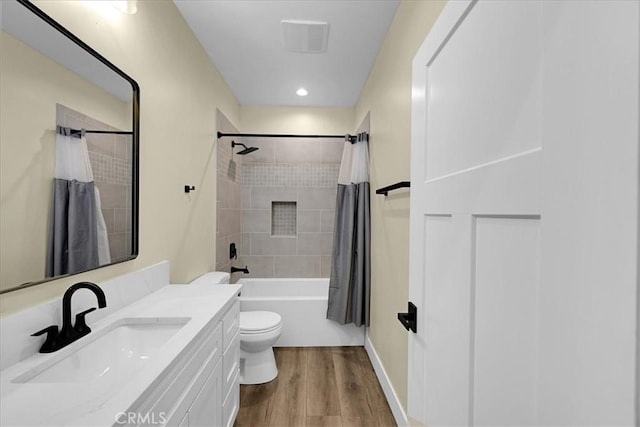 5350 Filbert St, Paradise, CA 95969 - full bathroom with vanity, wood finished floors, shower / tub combo, and recessed lighting