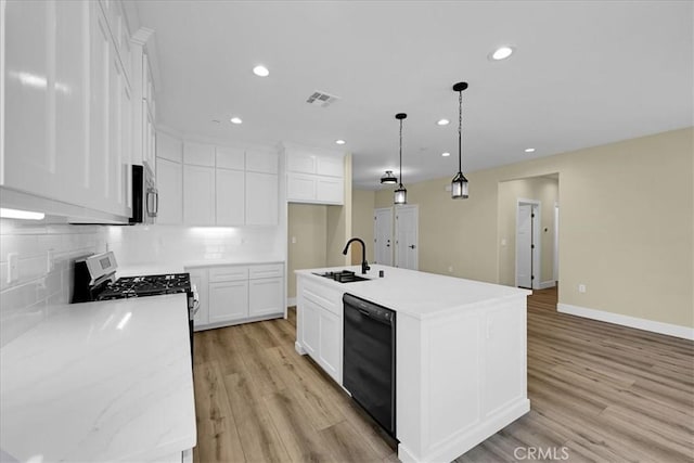 5350 Filbert St, Paradise, CA 95969 - kitchen featuring black dishwasher, gas range, backsplash, recessed lighting, and light wood-style floors