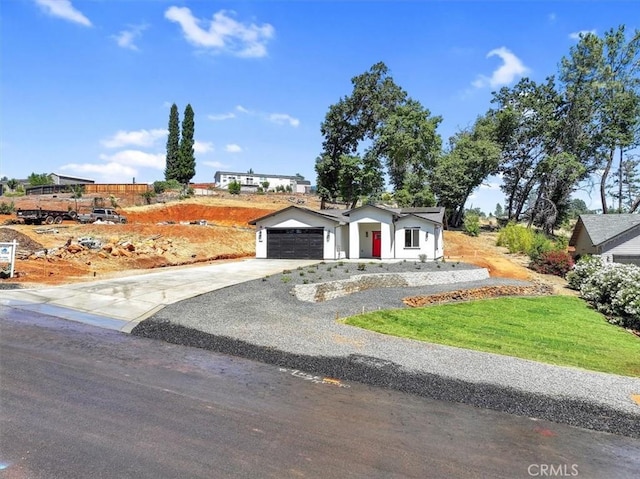 5350 Filbert St, Paradise, CA 95969 - view of front of house with driveway, an attached garage, and a front yard