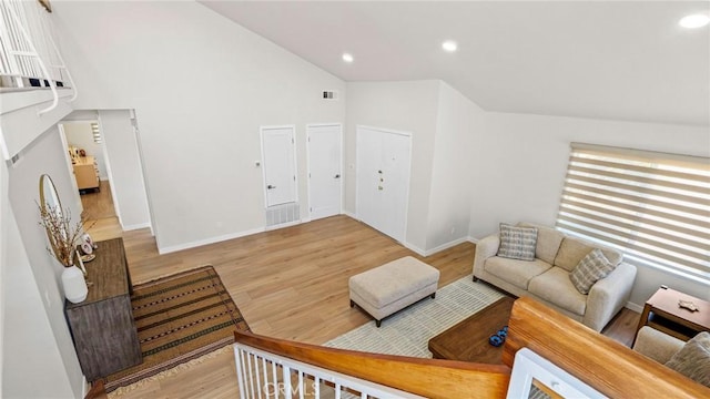 23208 Cuervo Dr, Valencia, CA 91354 - living area with wood finished floors, recessed lighting, and high vaulted ceiling