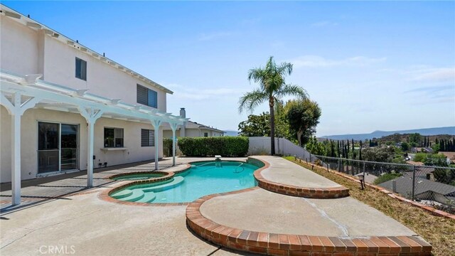 23208 Cuervo Dr, Valencia, CA 91354 - view of pool featuring a fenced backyard, a patio, a pergola, and a pool with connected hot tub