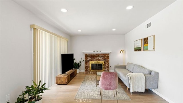 23208 Cuervo Dr, Valencia, CA 91354 - living room with light wood finished floors, recessed lighting, and a fireplace