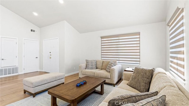 23208 Cuervo Dr, Valencia, CA 91354 - living area featuring wood finished floors and high vaulted ceiling