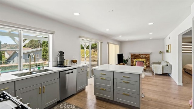23208 Cuervo Dr, Valencia, CA 91354 - kitchen with gray cabinetry, dishwasher, wood finished floors, light countertops, and recessed lighting