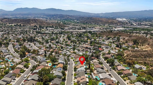 23208 Cuervo Dr, Valencia, CA 91354 - aerial view of property's location with a mountain backdrop and nearby suburban area