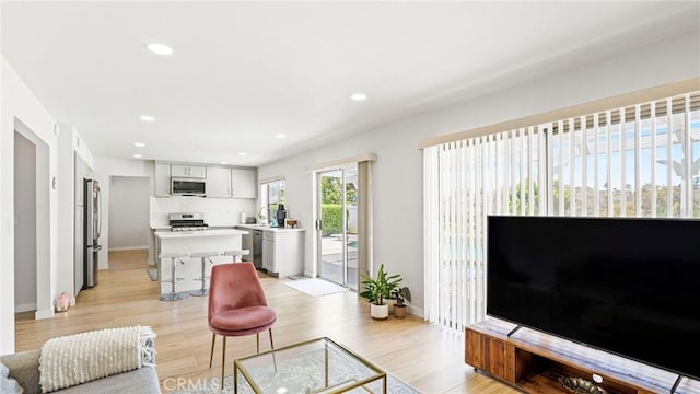 23208 Cuervo Dr, Valencia, CA 91354 - living area featuring light wood-style floors and recessed lighting