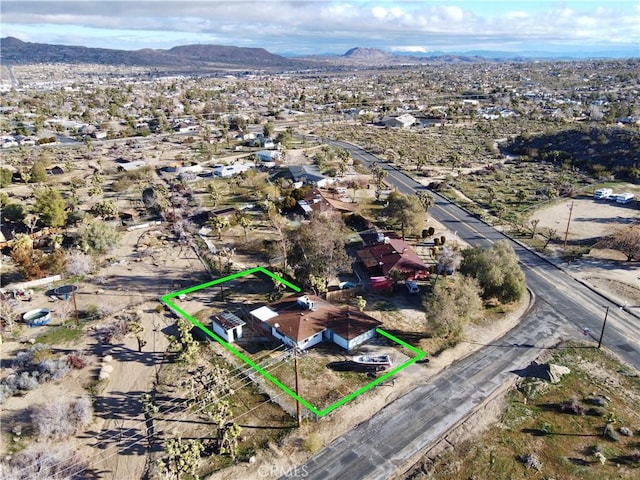 57136 Navajo Trl, Yucca Valley, CA 92284 - aerial view of property's location with property boundaries highlighted and mountains