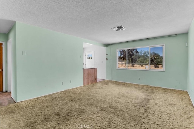 57136 Navajo Trl, Yucca Valley, CA 92284 - empty room featuring carpet floors and a textured ceiling
