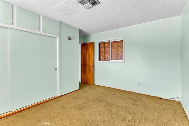 57136 Navajo Trl, Yucca Valley, CA 92284 - unfurnished room featuring light carpet and a textured ceiling