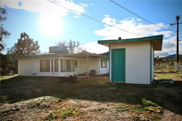 57136 Navajo Trl, Yucca Valley, CA 92284 - rear view of house with a shed
