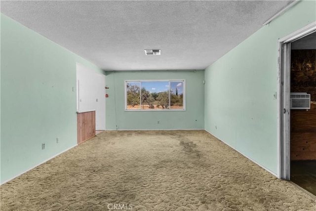 57136 Navajo Trl, Yucca Valley, CA 92284 - carpeted spare room with a textured ceiling