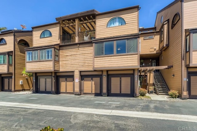 4014 Aguila St Unit F, Carlsbad, CA 92008 - view of building exterior featuring stairway and an attached garage