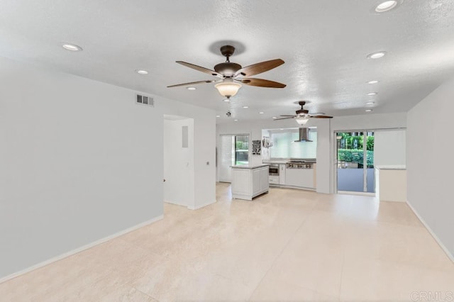 4014 Aguila St Unit F, Carlsbad, CA 92008 - unfurnished living room featuring recessed lighting, a ceiling fan, and a textured ceiling