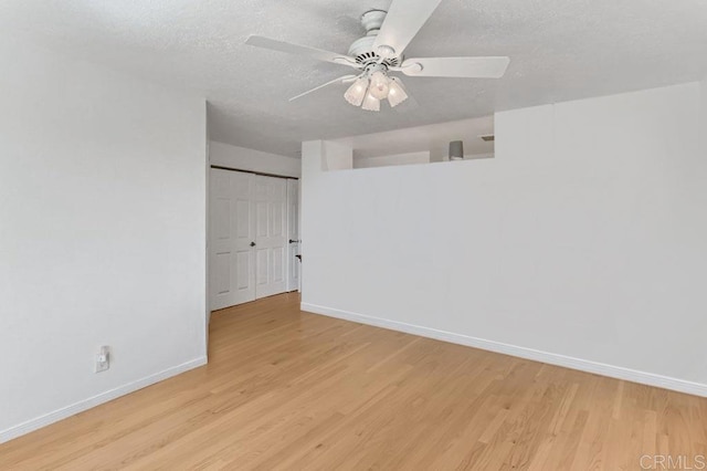 4014 Aguila St Unit F, Carlsbad, CA 92008 - unfurnished room with light wood-type flooring, a ceiling fan, and a textured ceiling