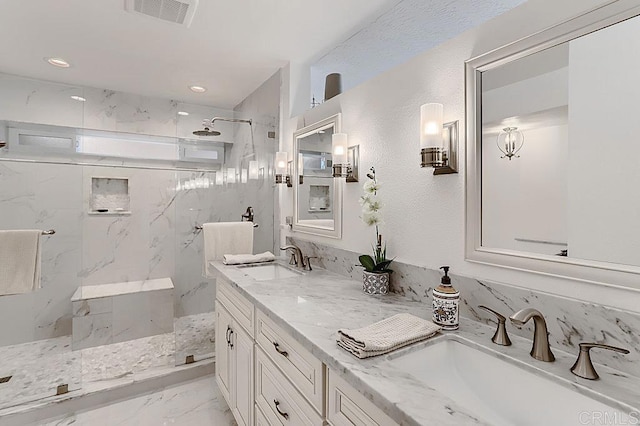4014 Aguila St Unit F, Carlsbad, CA 92008 - bathroom featuring double vanity, a marble finish shower, marble look tile flooring, and recessed lighting