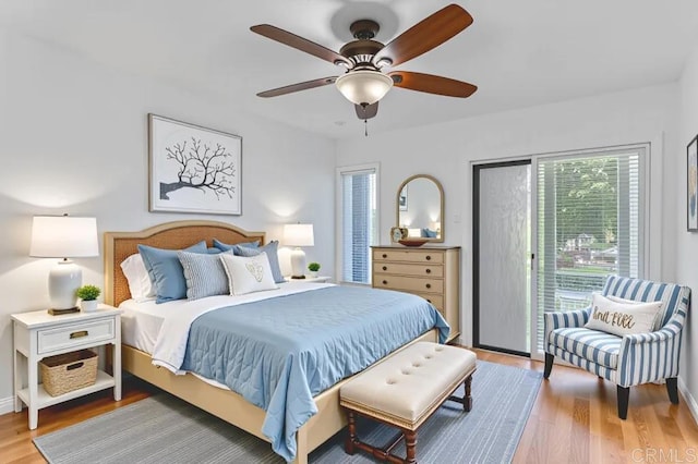 4014 Aguila St Unit F, Carlsbad, CA 92008 - bedroom with access to outside and wood finished floors