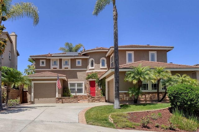 13748 Torrey Glenn Rd, San Diego, CA 92129 - mediterranean / spanish-style house featuring a garage, stone siding, stucco siding, and roof mounted solar panels