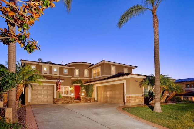 13748 Torrey Glenn Rd, San Diego, CA 92129 - mediterranean / spanish home featuring stucco siding, stone siding, driveway, and a garage