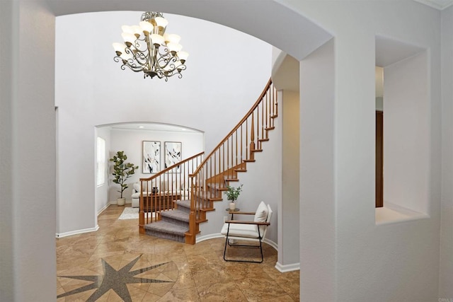 13748 Torrey Glenn Rd, San Diego, CA 92129 - foyer with arched walkways, a chandelier, stairway, and a high ceiling