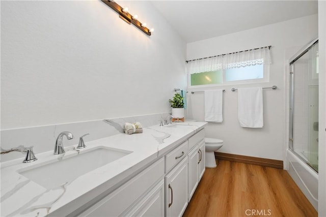 9 Aberdeen St, Irvine, CA 92620 - bathroom with double vanity, wood finished floors, and combined bath / shower with glass door