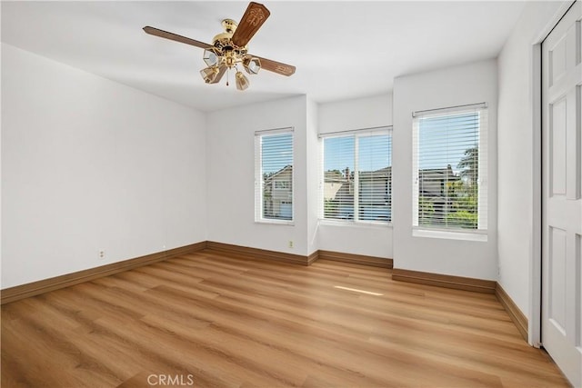 9 Aberdeen St, Irvine, CA 92620 - unfurnished room with healthy amount of natural light, light wood-style flooring, and ceiling fan
