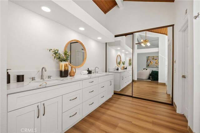 9 Aberdeen St, Irvine, CA 92620 - bathroom featuring double vanity, ceiling fan, wood finished floors, a freestanding bath, and recessed lighting