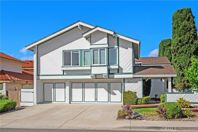 9 Aberdeen St, Irvine, CA 92620 - view of front of home with driveway, an attached garage, and a shingled roof