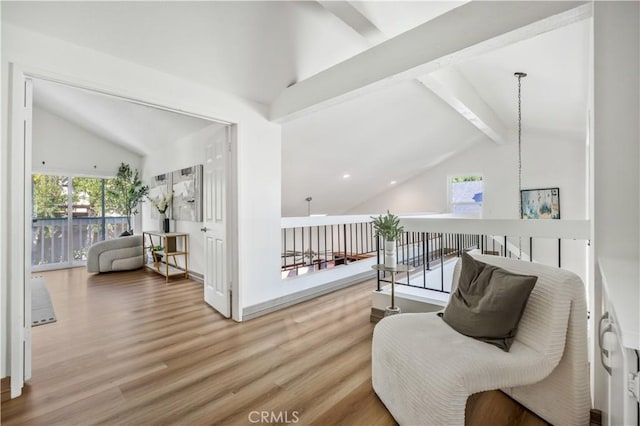 9 Aberdeen St, Irvine, CA 92620 - sitting room with beamed ceiling, wood finished floors, and high vaulted ceiling