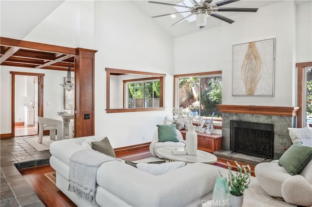 9 Aberdeen St, Irvine, CA 92620 - living room featuring beam ceiling, a high end fireplace, a ceiling fan, stone tile flooring, and high vaulted ceiling
