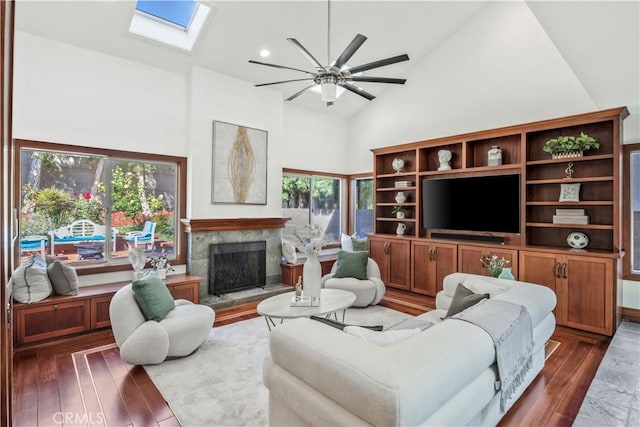 9 Aberdeen St, Irvine, CA 92620 - living room featuring high vaulted ceiling, hardwood / wood-style flooring, a skylight, ceiling fan, and healthy amount of natural light