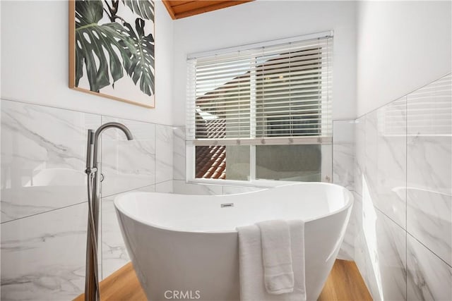9 Aberdeen St, Irvine, CA 92620 - full bath with tile walls, a freestanding bath, and a wainscoted wall