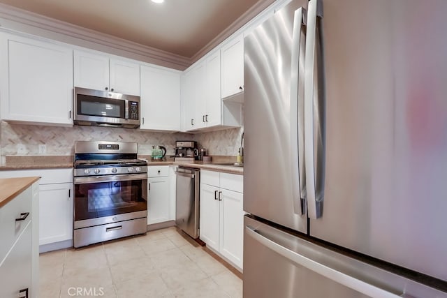 6938 Laurel Canyon Blvd Unit 101, North Hollywood, CA 91605 - kitchen with stainless steel appliances, light countertops, white cabinets, and tasteful backsplash