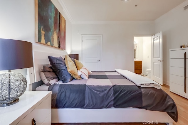 6938 Laurel Canyon Blvd Unit 101, North Hollywood, CA 91605 - bedroom with ornamental molding, light wood-type flooring, and ensuite bathroom