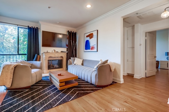 6938 Laurel Canyon Blvd Unit 101, North Hollywood, CA 91605 - living room with wood finished floors, crown molding, a glass covered fireplace, and recessed lighting