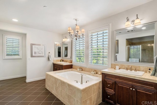 16210 Bluestar Way, San Diego, CA 92127 - bathroom with two vanities, a stall shower, a bath, a chandelier, and tile patterned flooring